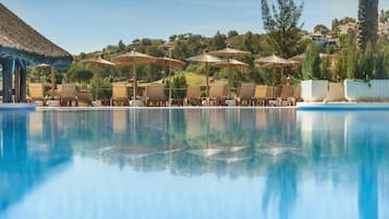 Indoor pool, outdoor pool, pool umbrellas, sun loungers