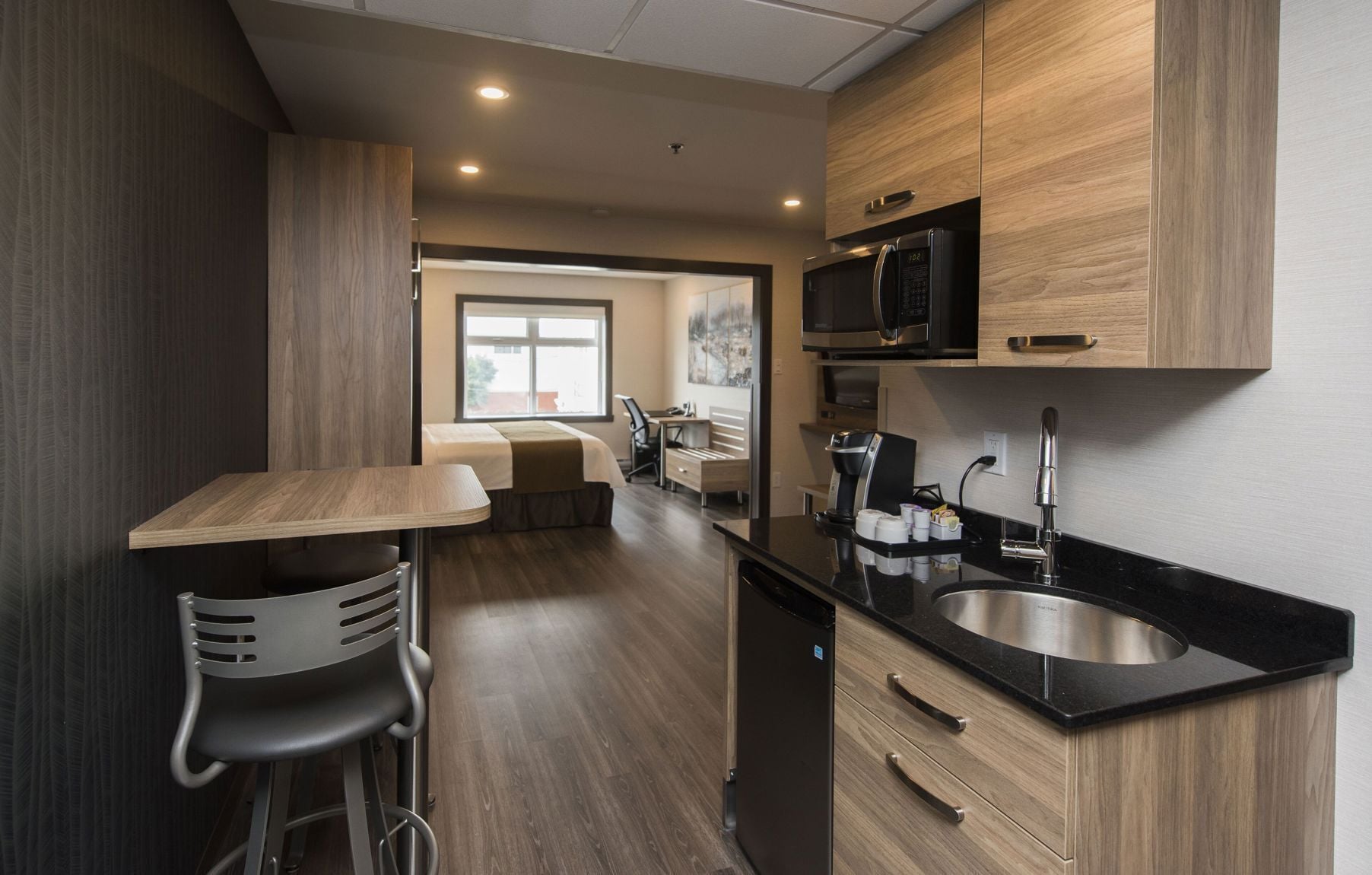 Premium bedding, desk, laptop workspace, blackout drapes