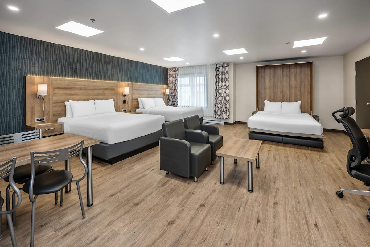 Premium bedding, desk, laptop workspace, blackout curtains