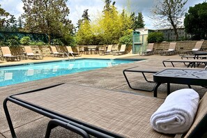 Seasonal outdoor pool, open 9:00 AM to 9:00 PM, pool loungers