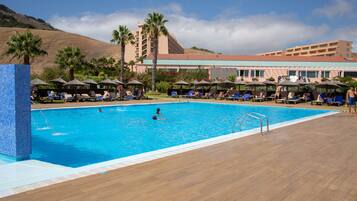 Indoor pool, outdoor pool, pool umbrellas, pool loungers