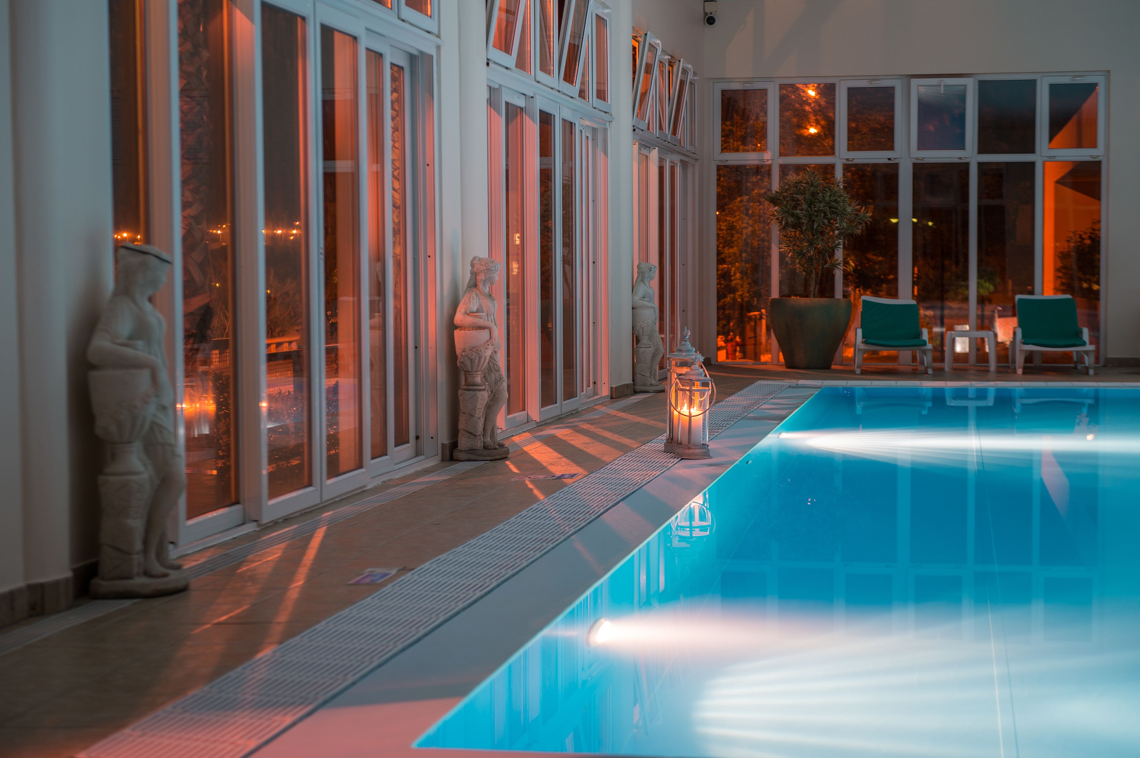 Indoor pool, outdoor pool, pool umbrellas, pool loungers