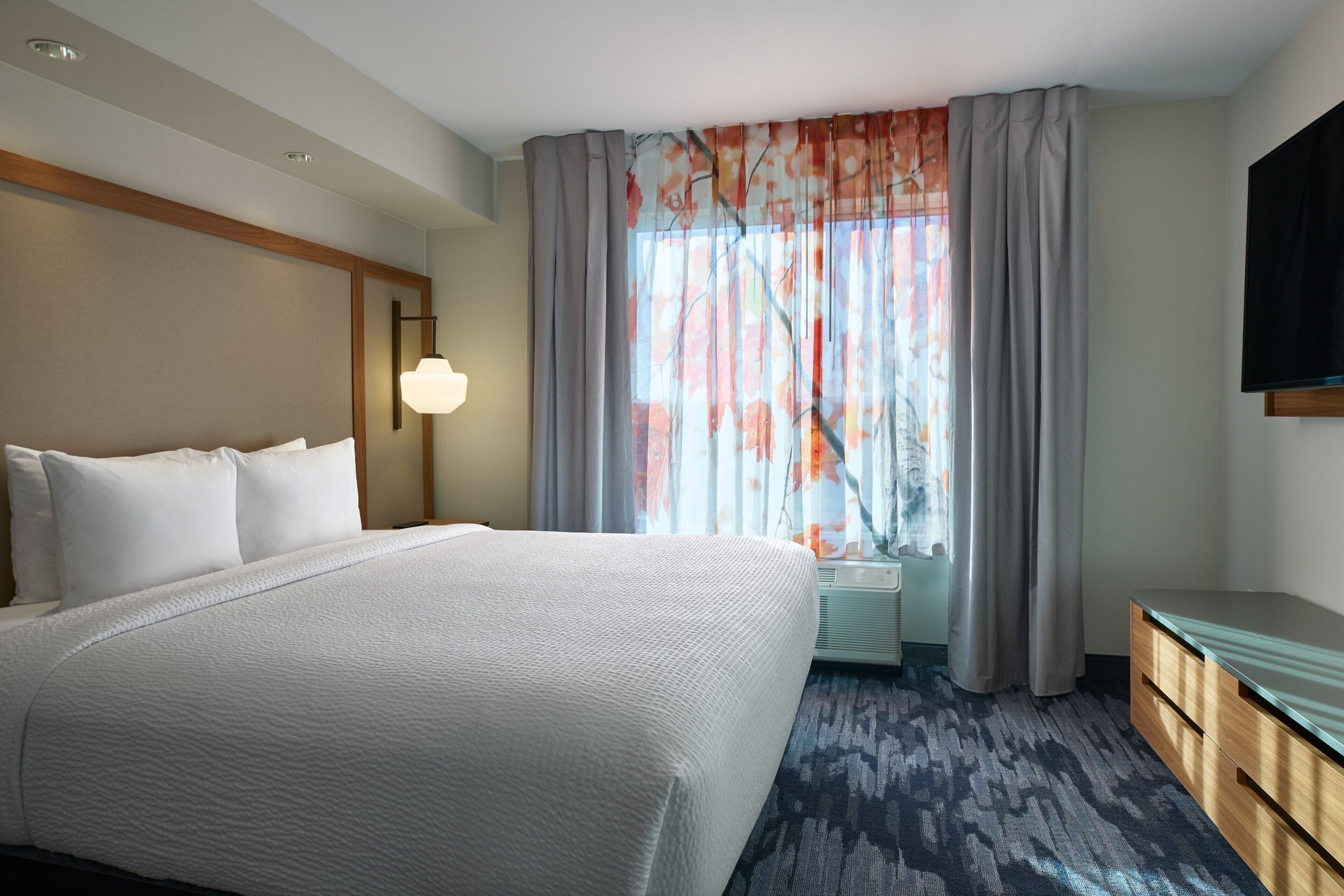 select comfort beds, desk, laptop workspace, blackout curtains