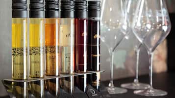A display of wine bottles and wine glasses on a table.