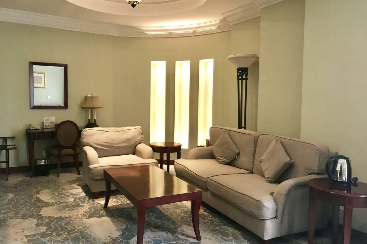 Suite, River View | Living area | TV