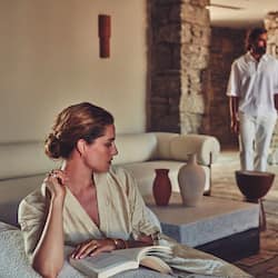 Guests can unwind in this peaceful space with a comfortable bench and serene ambiance.