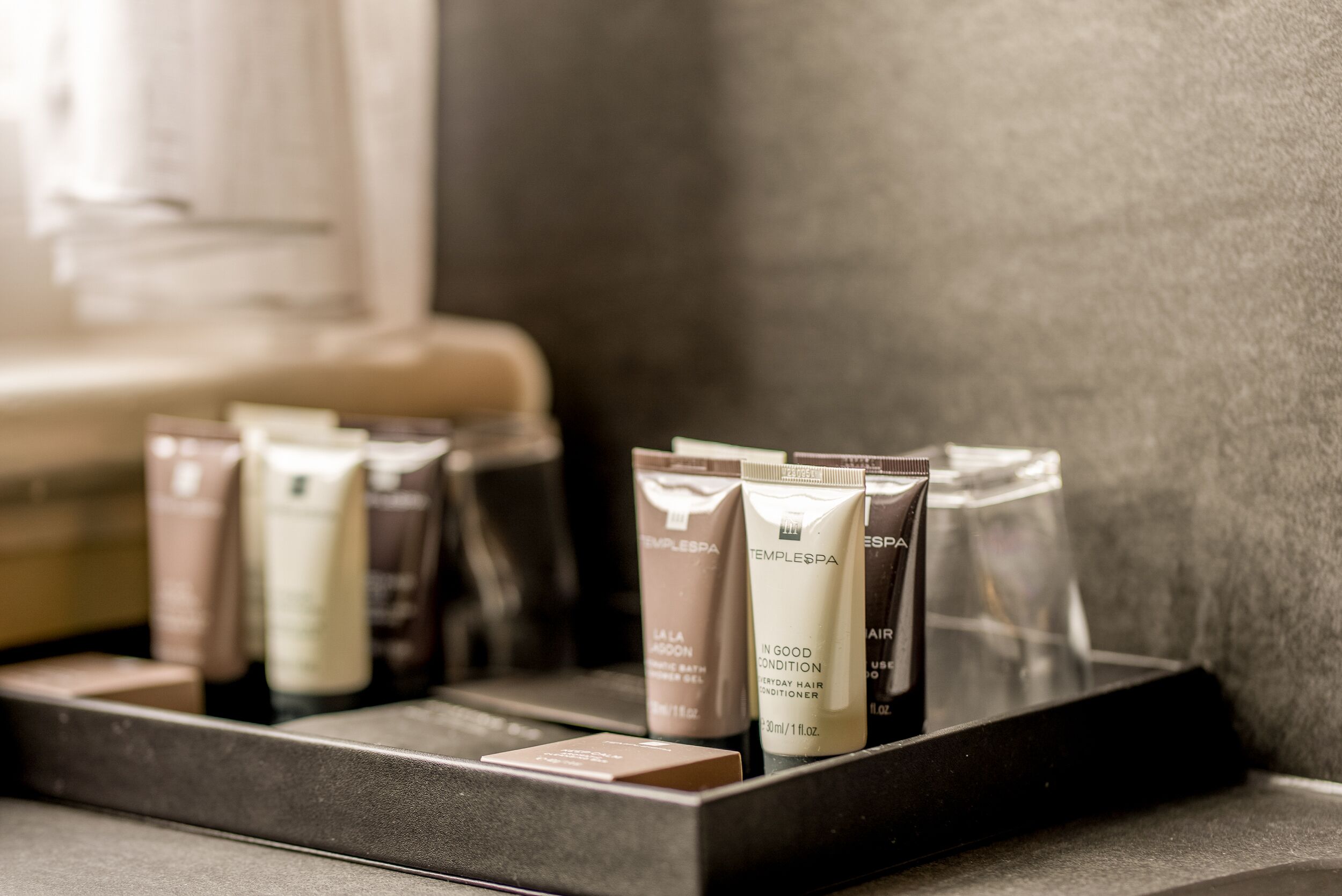A display of toiletries in a hotel setting.