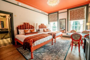 A hotel room with two beds, a dining area, and large windows. - Hunton Park Hotel (Abbots Langley)