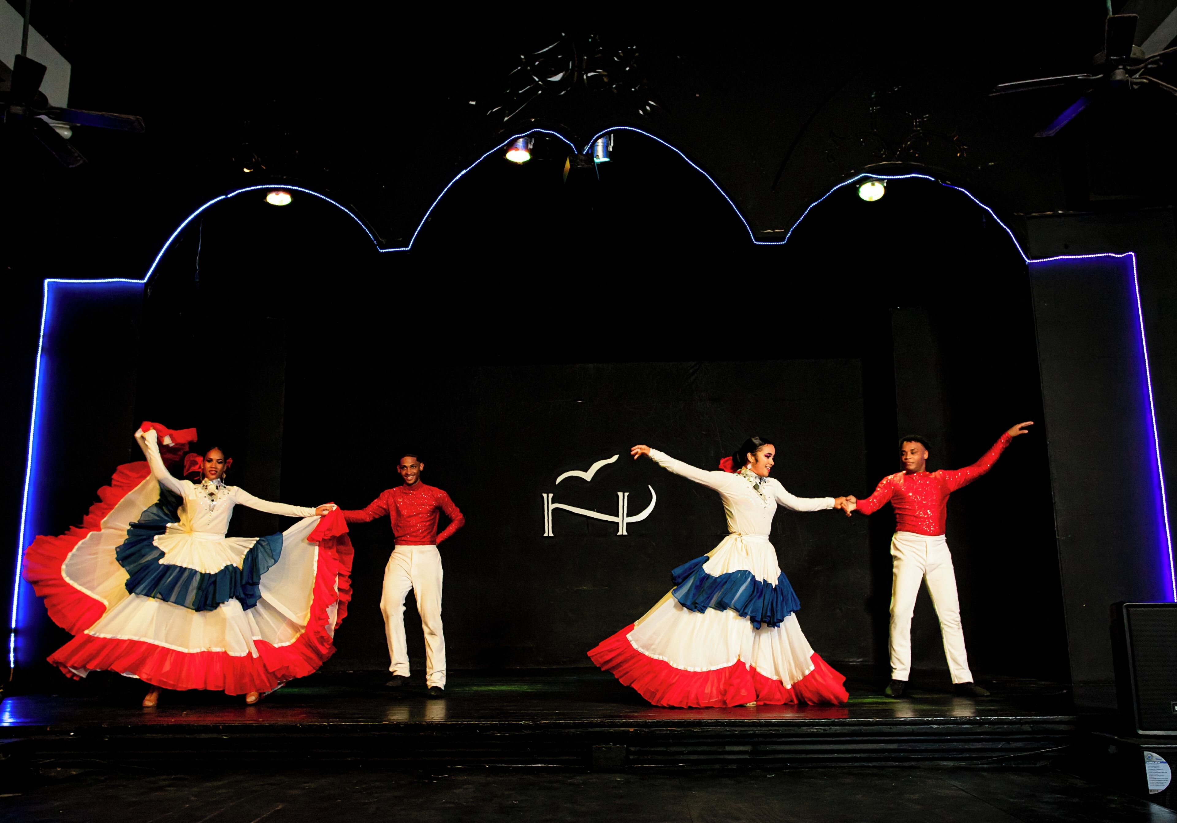 A stage with performers in traditional costumes.