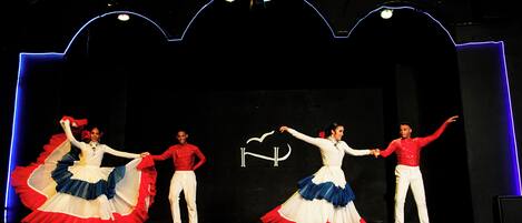 A stage with performers in traditional costumes.