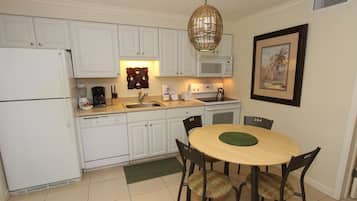 Fridge, microwave, coffee/tea maker, cookware/dishes/utensils
