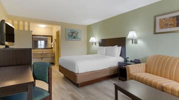 Habitación Deluxe, 1 cama Queen size | Área de sala de estar | Televisión de pantalla plana de 32 pulgadas con canales vía satélite