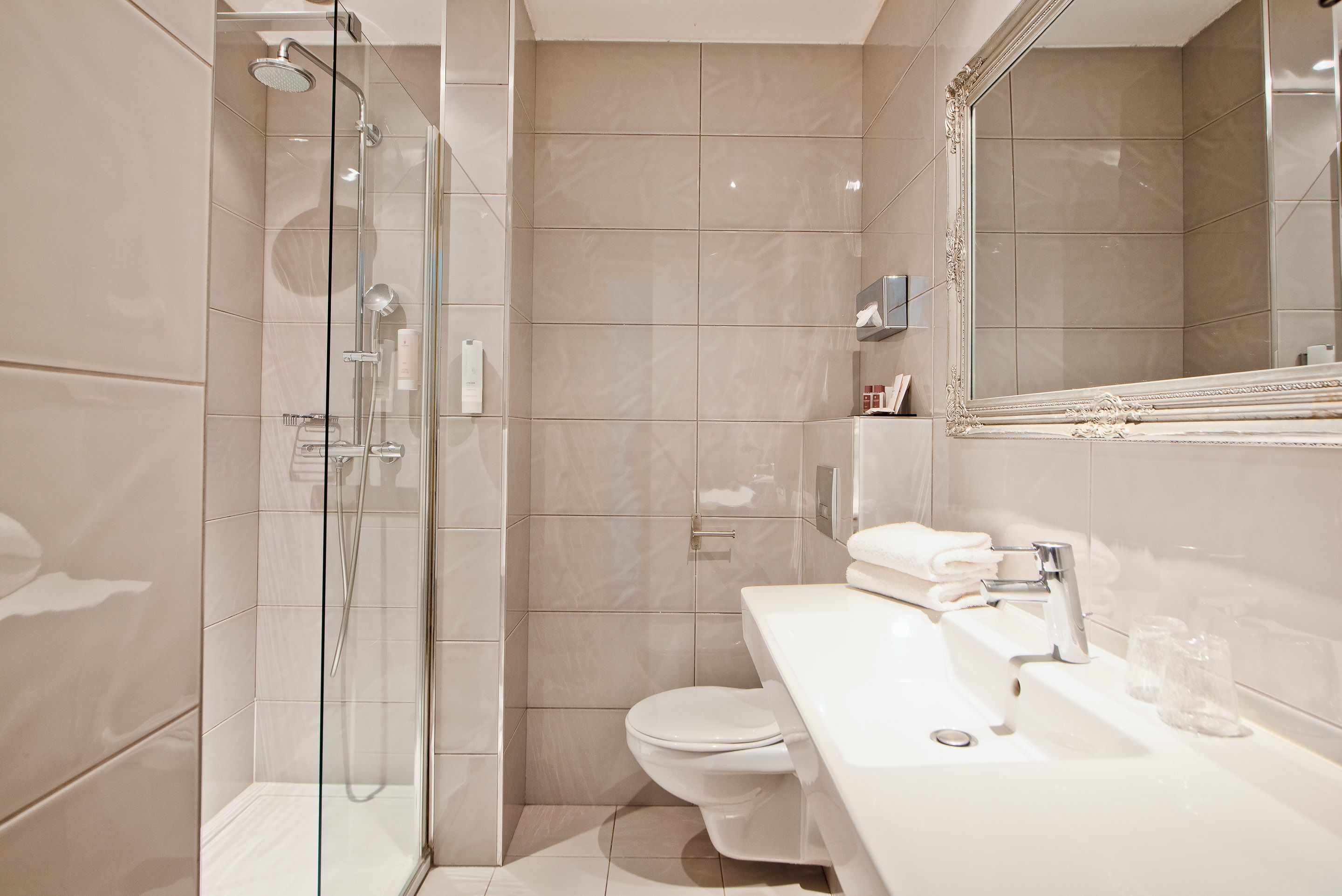 shower, rainfall showerhead, hair dryer, towels