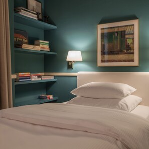Habitación individual clásica | Ropa de cama de alta calidad y edredones de plumas