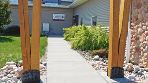 A wooden sign for Governor's Pub with a pathway leading to the building. - Days Inn by Wyndham Fargo/Casselton Waterpark (Casselton)