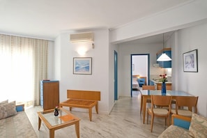 Family Apartment, 1 Bedroom | Living area | TV