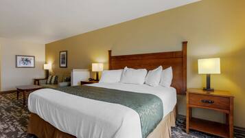 Premium bedding, desk, laptop workspace, blackout drapes