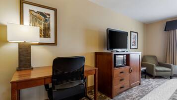 Premium bedding, desk, laptop workspace, blackout drapes