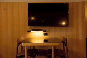 Executive Twin Room | Desk, blackout drapes, iron/ironing board, travel crib