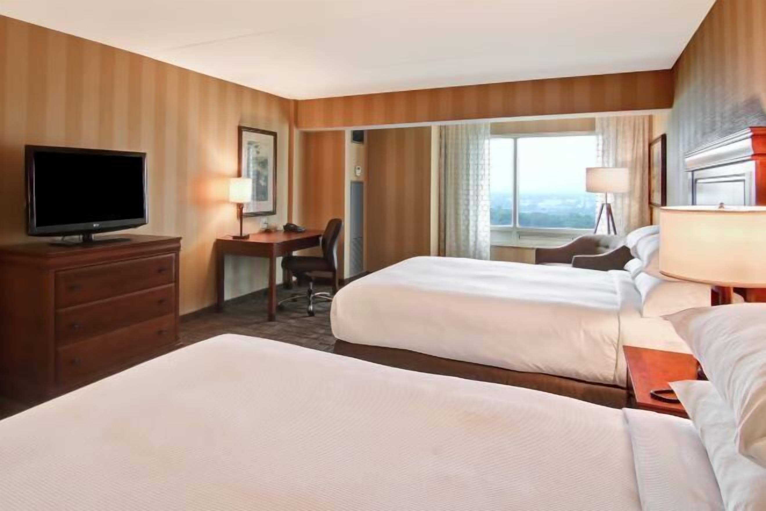 Premium bedding, down comforters, pillowtop beds, in-room safe