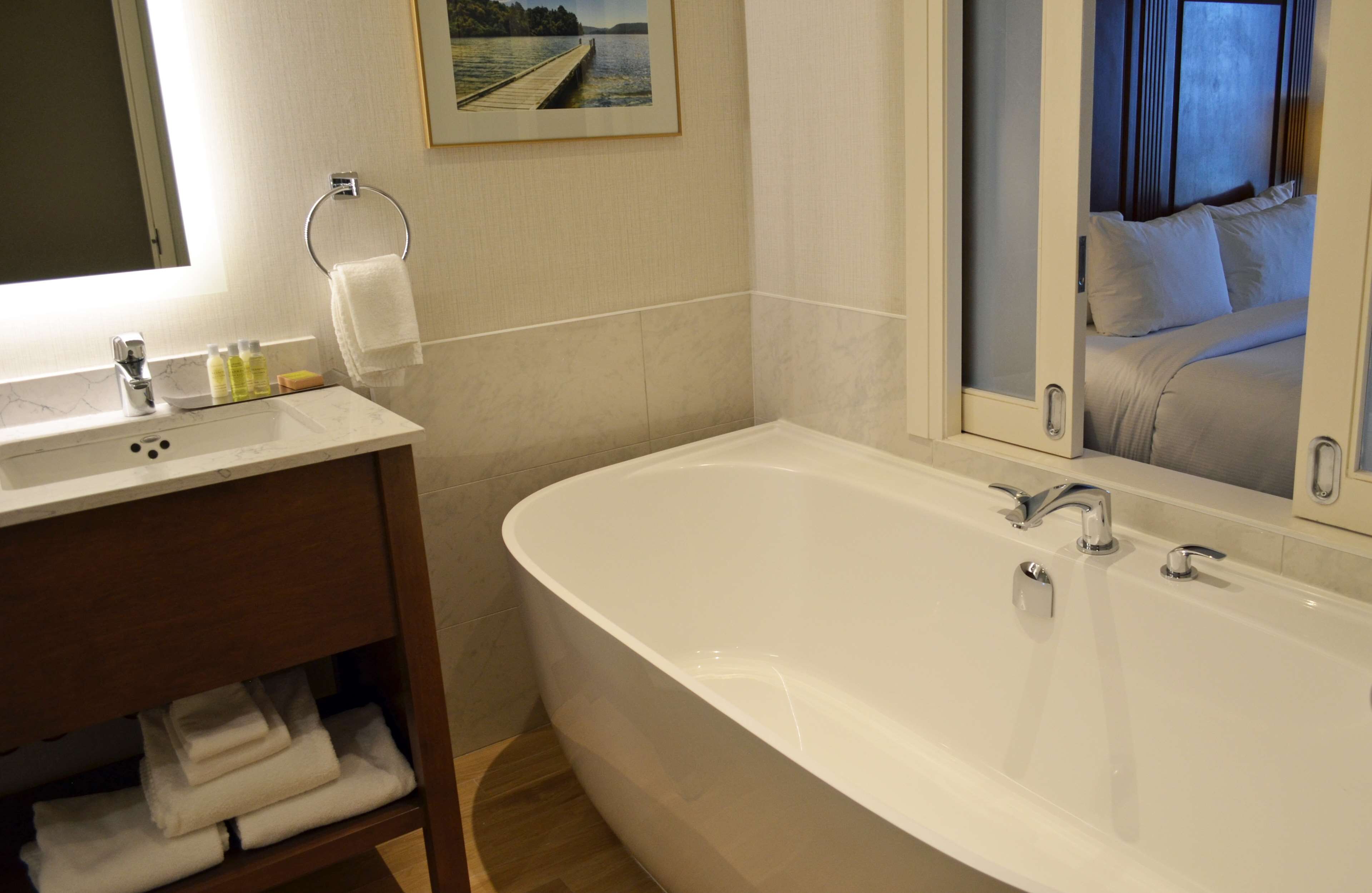 premium room, 1 king bed, soaker tub, us falls view | bathroom | hair dryer, towels, soap, shampoo
