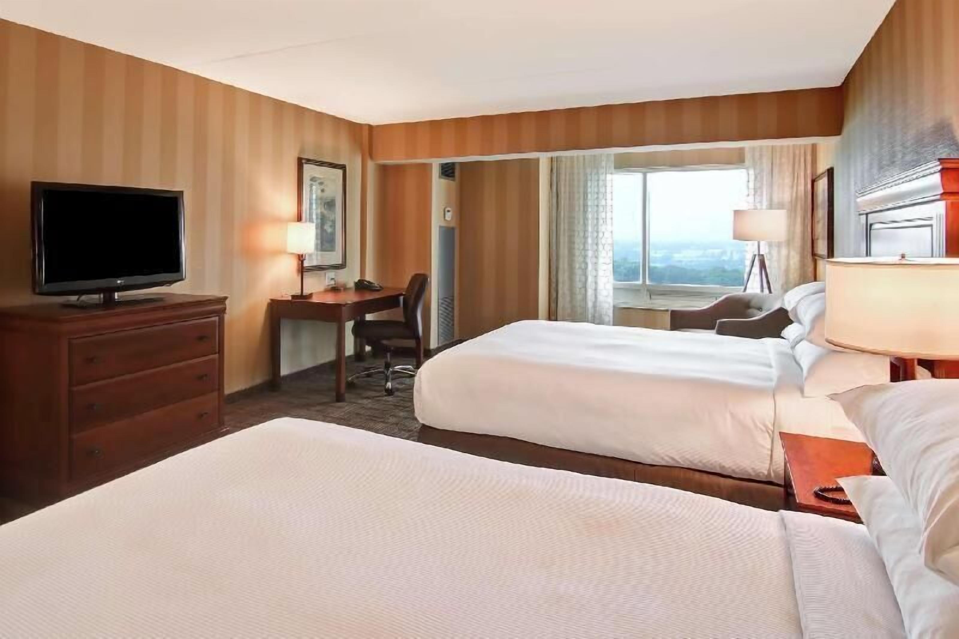 Premium bedding, down duvets, pillow-top beds, in-room safe