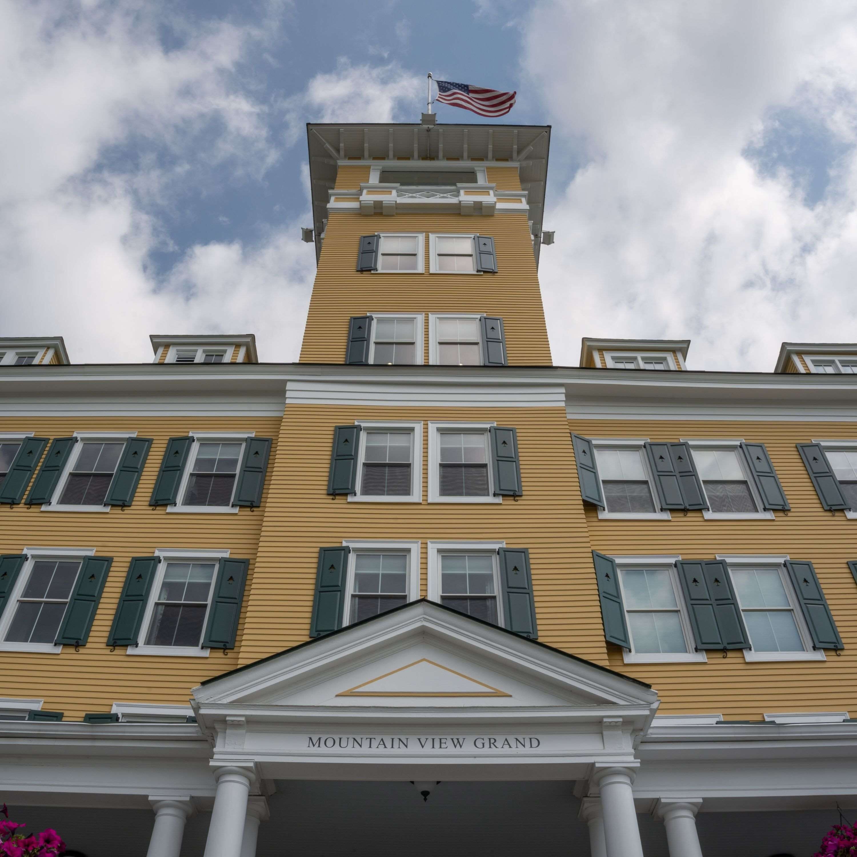 A building with a sign reading "MOUNTAIN VIEW GRAND".