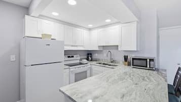 Premium Condo | Private kitchen | Full-size fridge, microwave, stovetop, coffee/tea maker