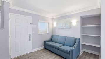 Premium Condo | Living area | Flat-screen TV, DVD player