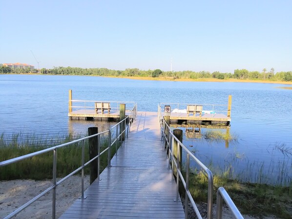 Stroll along the boardwalk to two tranquil docks, equipped with benches and a clear no swimming zone sign.