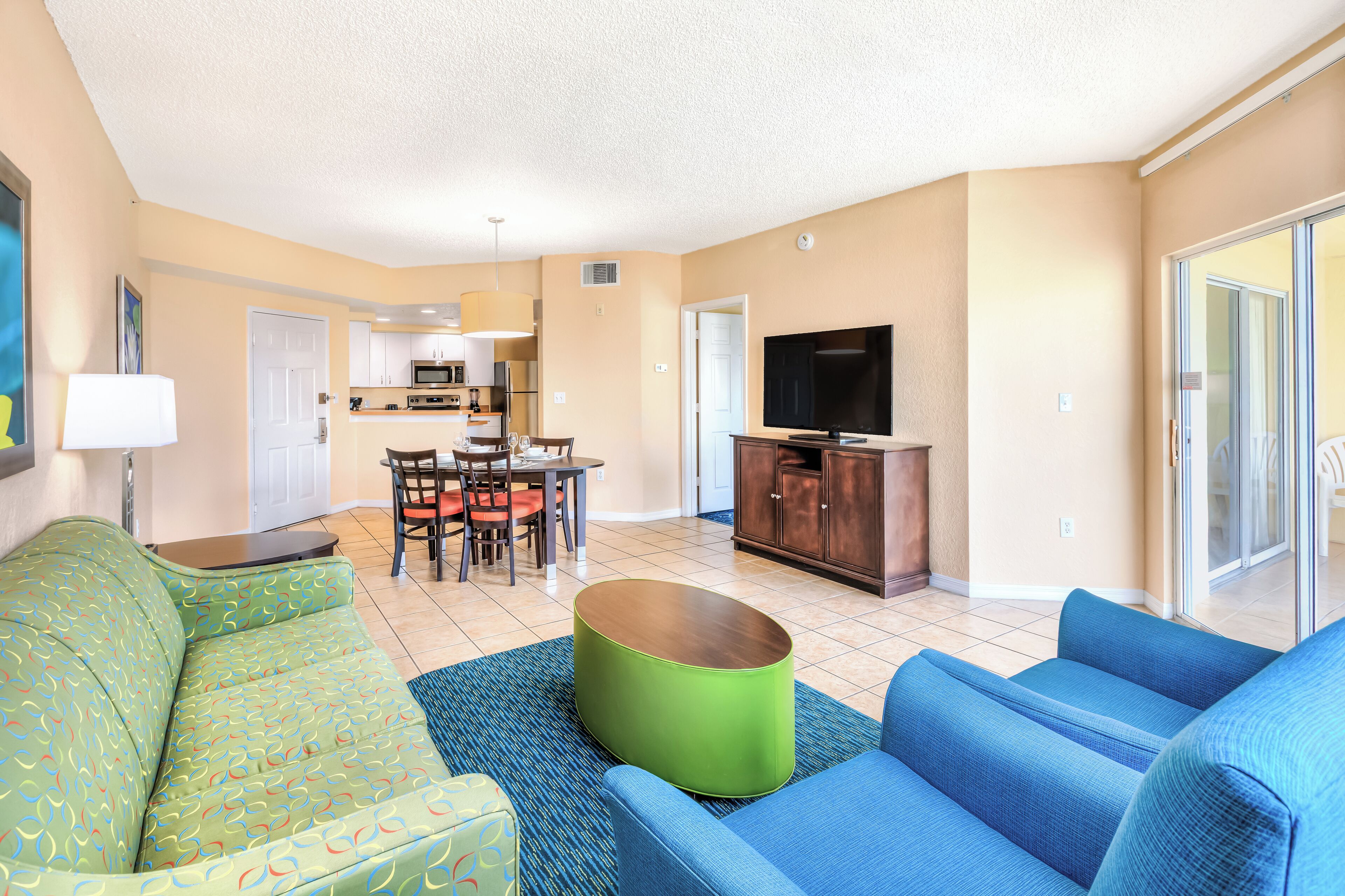Deluxe King Suite, Kitchen | Living area | 32-inch TV with cable channels, DVD player
