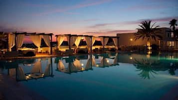 Seasonal outdoor pool, open 9:00 AM to 7:00 PM, pool umbrellas