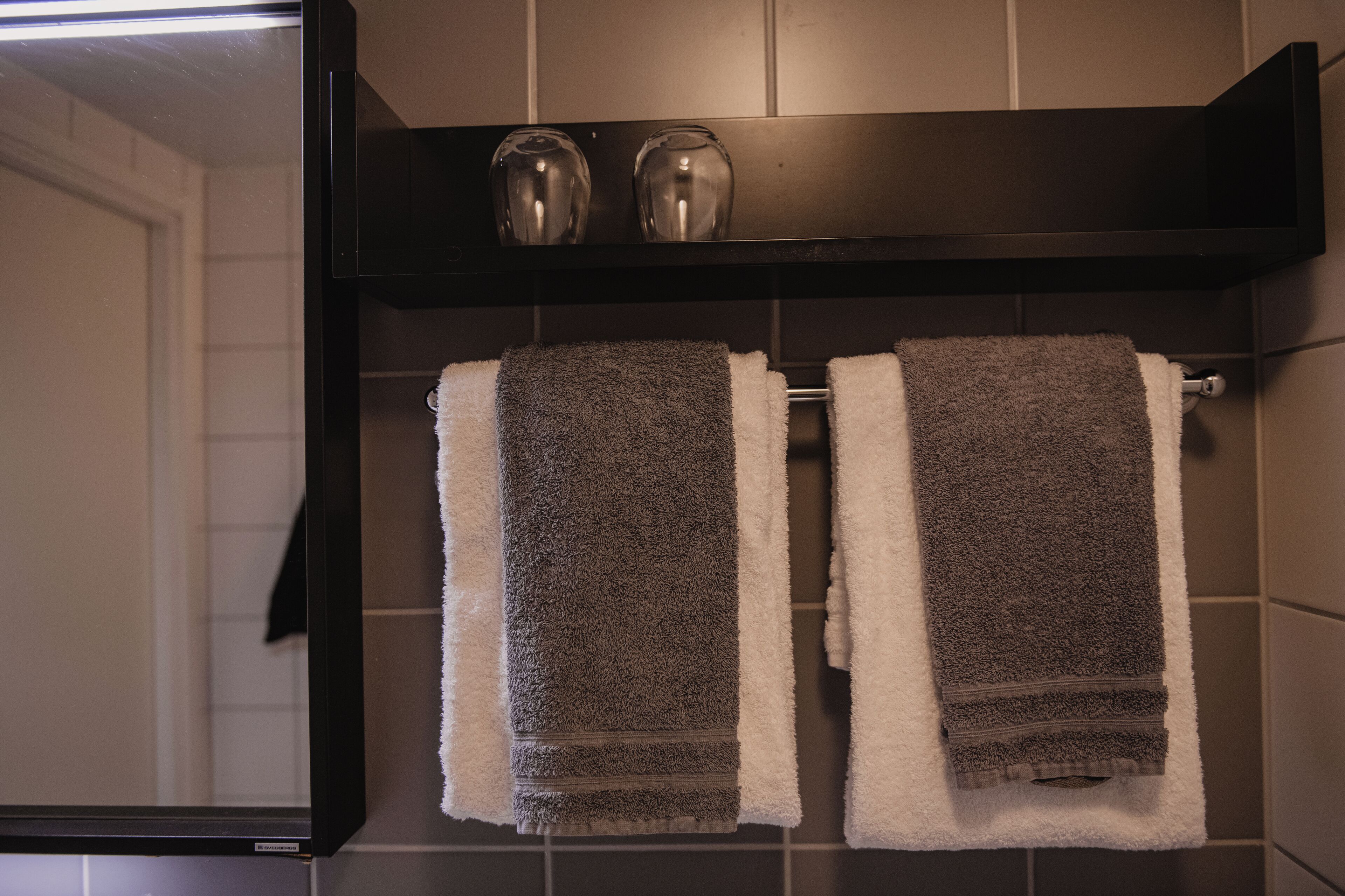 shower, hair dryer, towels, shampoo