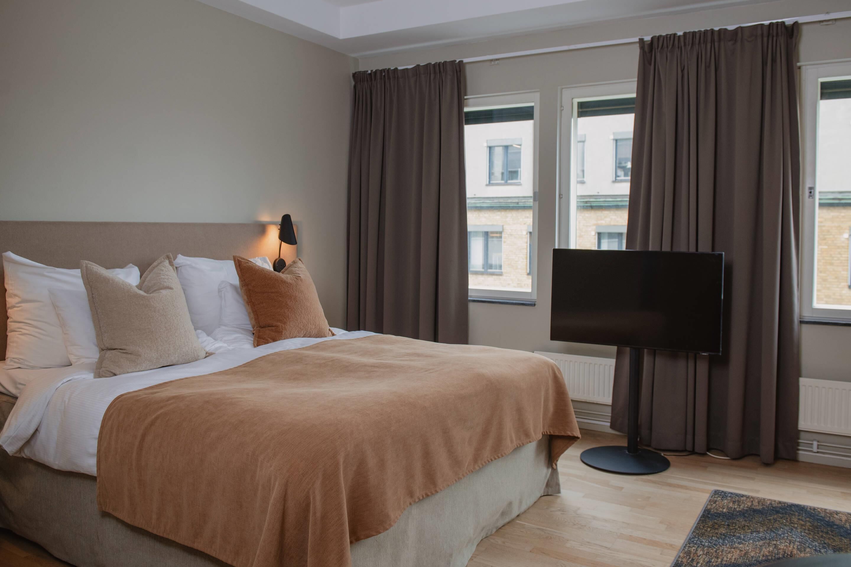 Desk, blackout drapes, iron/ironing board, bed sheets