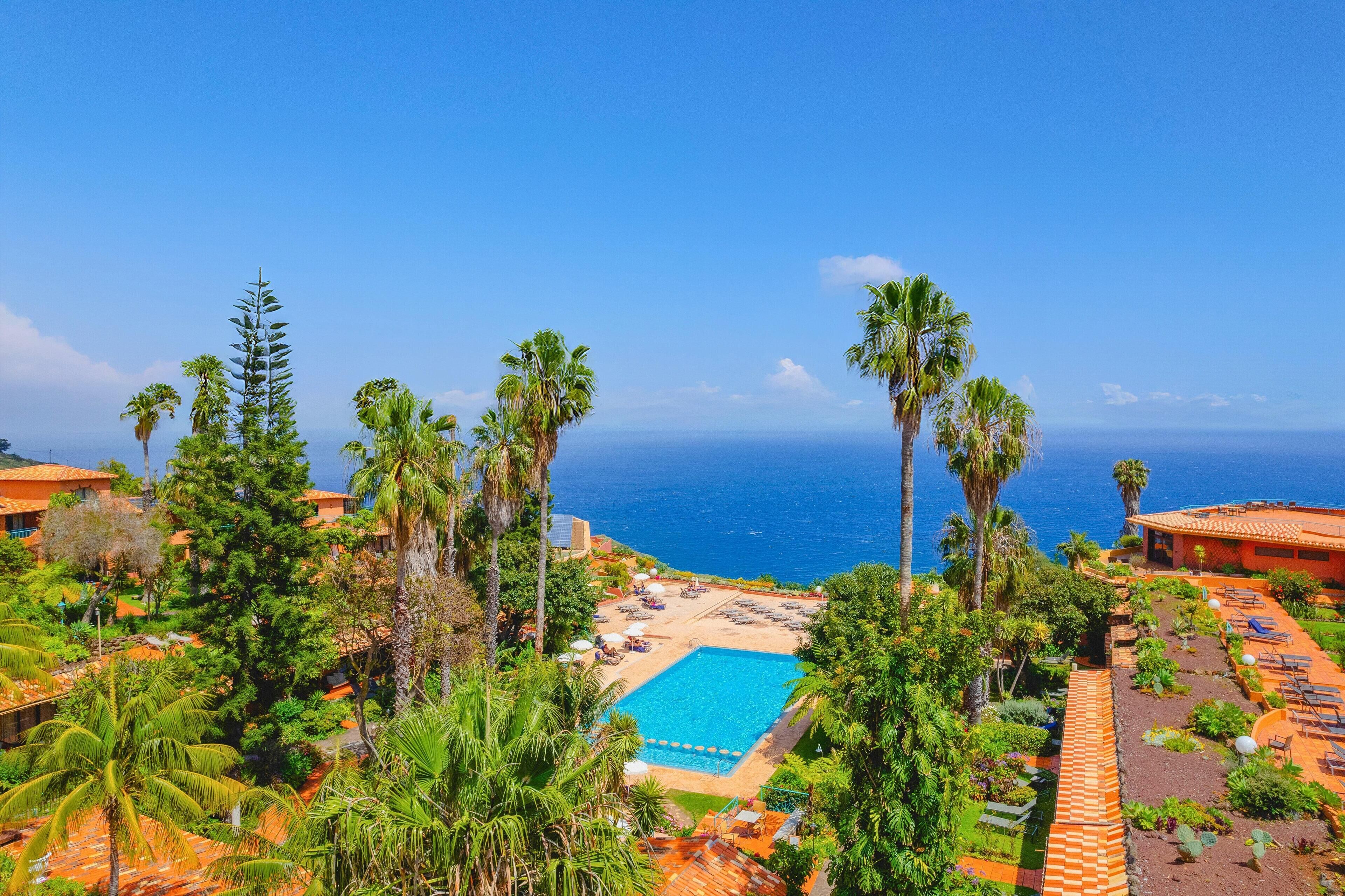 Indoor pool, outdoor pool, pool umbrellas, sun loungers