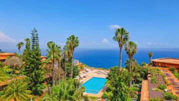 Indoor pool, outdoor pool, pool umbrellas, sun loungers