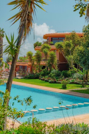 Indoor pool, outdoor pool, open 10:00 AM to 7:00 PM, pool umbrellas