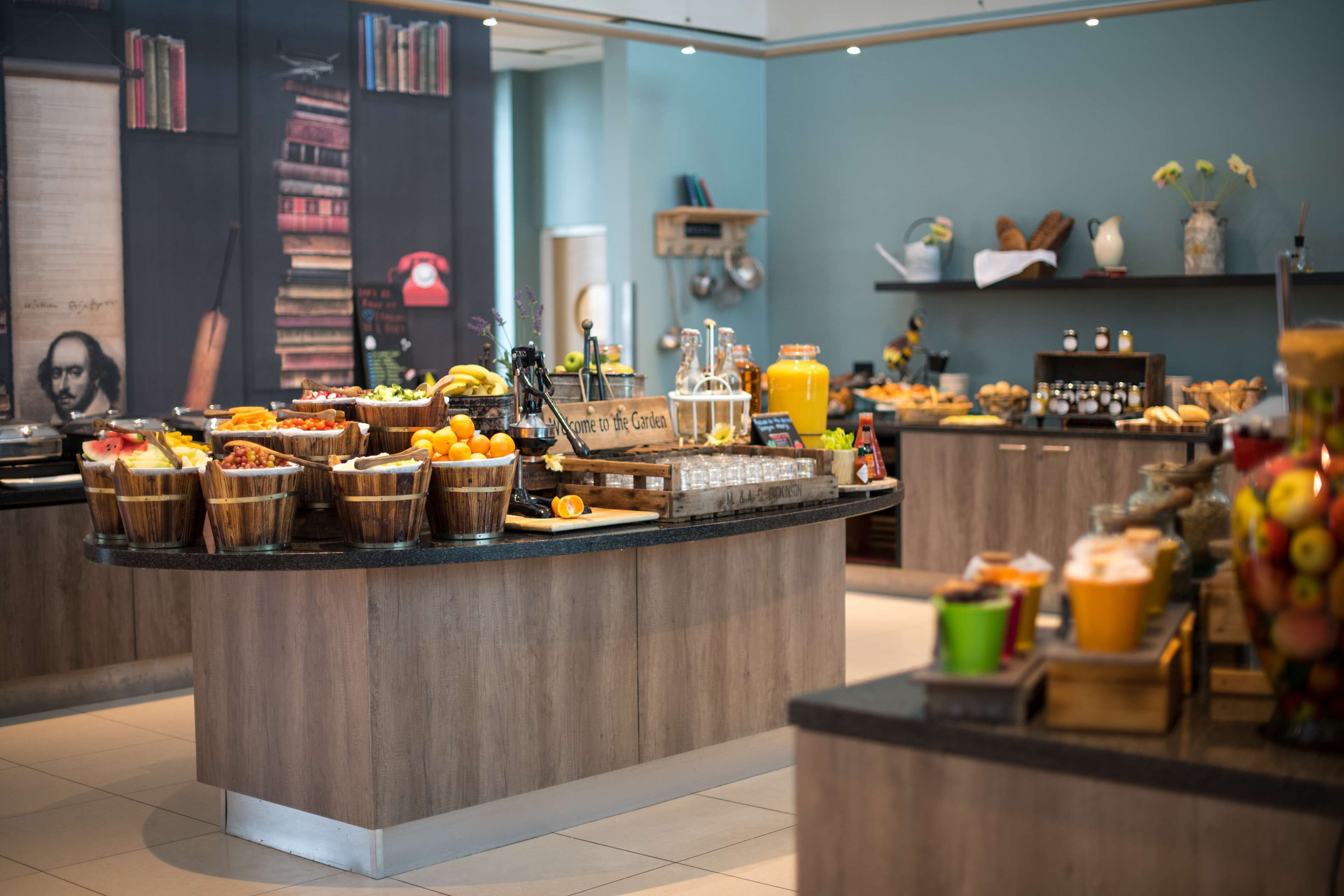 A buffet area with various food items and beverages.