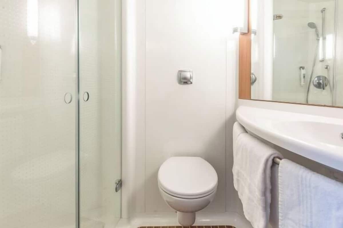 Bathroom | Shower, eco-friendly toiletries, hair dryer, towels