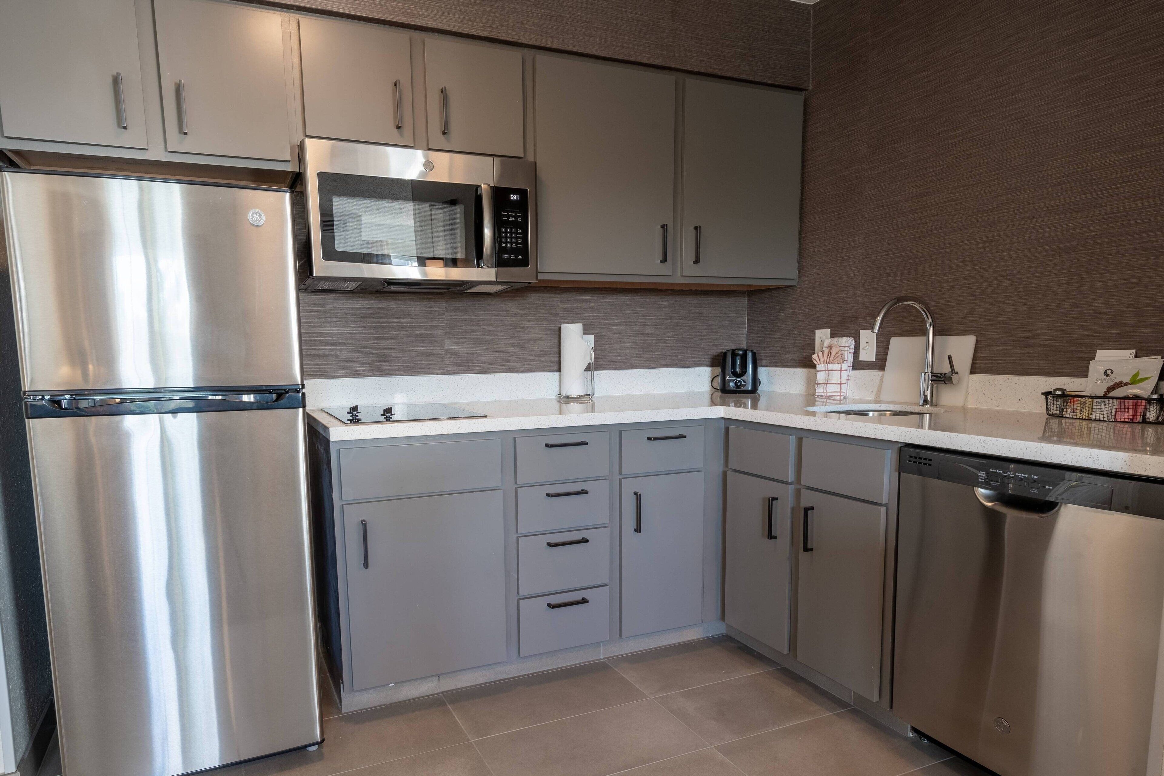 full-sized fridge, microwave, stovetop, dishwasher