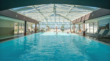 Indoor pool, pool umbrellas, sun loungers