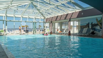 Indoor pool, pool umbrellas, pool loungers