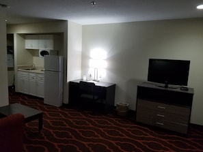 Suite, 1 King Bed, Non Smoking | Living area | 50-inch LED TV with cable channels, TV