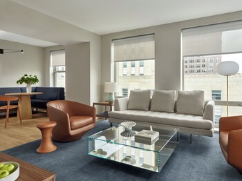 Signature Suite | Living area | 46-inch TV with satellite channels, iPod dock, pay movies at Hotel AKA Back Bay