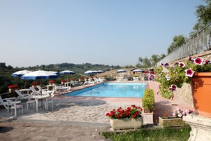 Seasonal outdoor pool, pool umbrellas