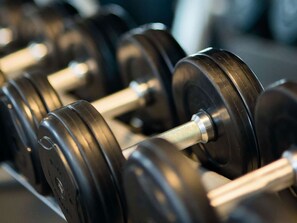 A close-up of a row of black dumbbells with silver weights. - Leonardo Hotel Dublin Parnell Street (Dublin)