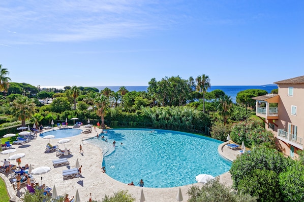 Seasonal outdoor pool, pool umbrellas, pool loungers