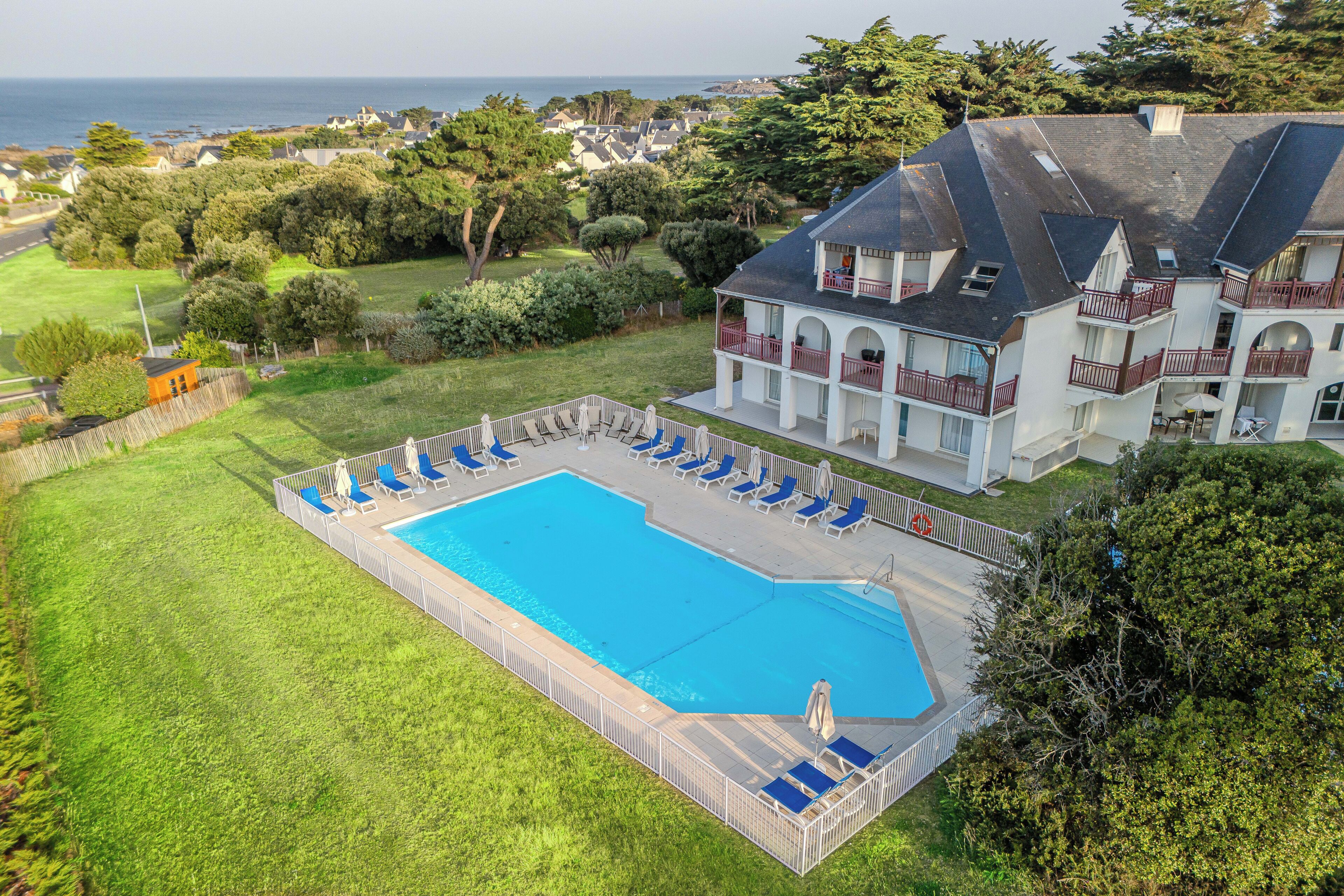 Seasonal outdoor pool, pool umbrellas, pool loungers