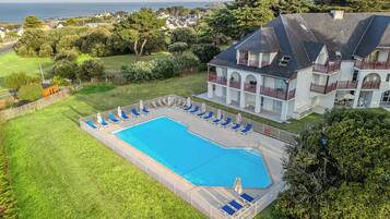 Seasonal outdoor pool, pool umbrellas, pool loungers