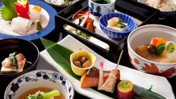 A variety of Japanese dishes arranged on a tray.